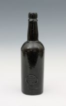 A dark green glass wine Inner Temple bottle with seal mid-late 19th century, 9¾in. (25cm.) high. *