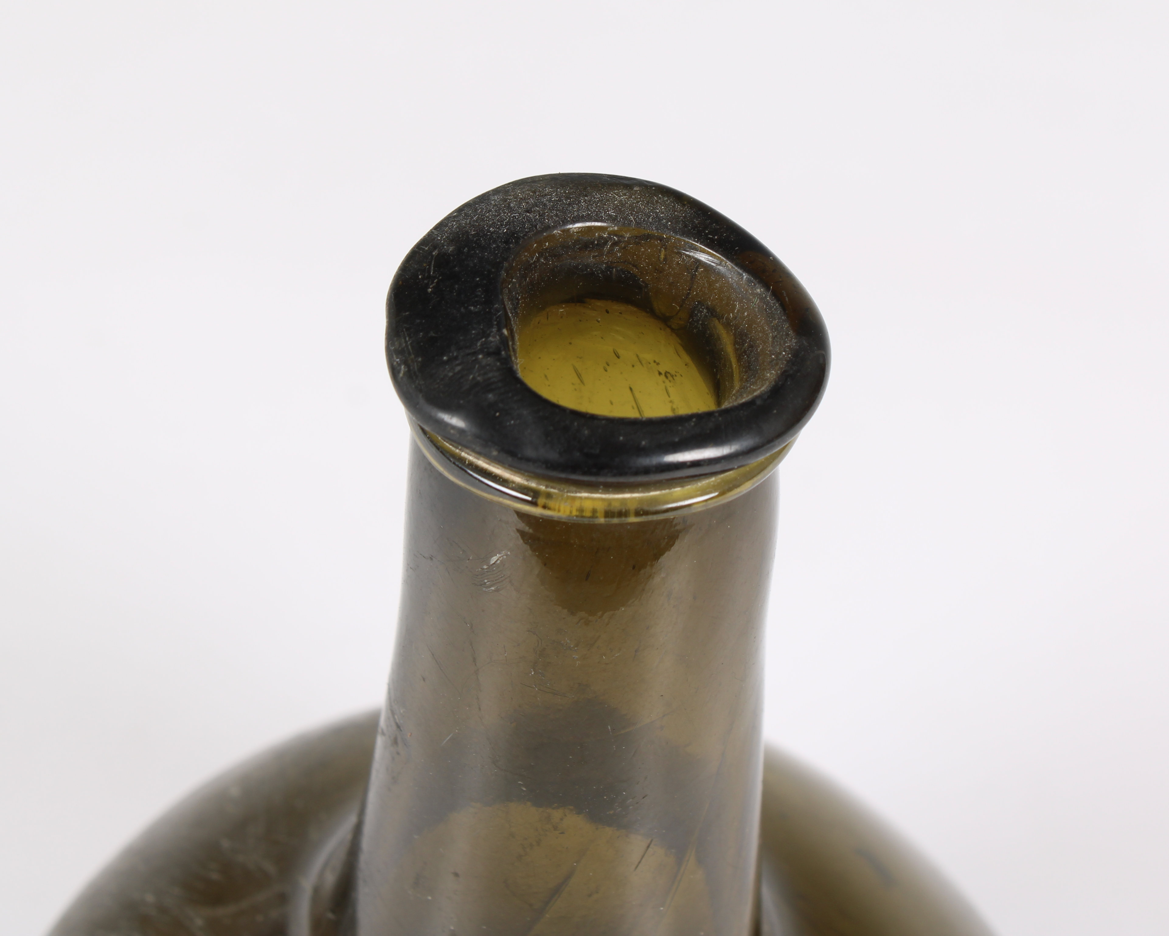 A green glass wine bottle of mallet form with trailed string rim probably mid 18th century, dark - Image 3 of 3