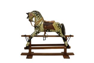 A vintage dappled grey rocking horse probably first half twentieth century, gesso and painted,
