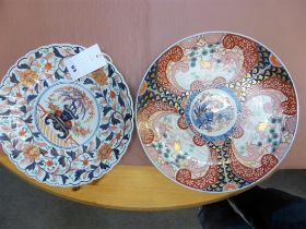 Two late 19th century Japanese Imari chargers one with scalloped rim, decorated with a bonsai tree