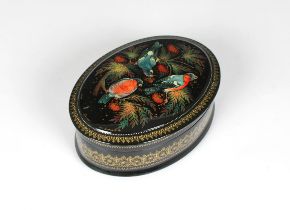 A mid to late 20th century Russian lacquered canister box of oval form, the hinged cover depicting