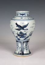 A Chinese blue & white porcelain vase of baluster form decorated in underglaze blue with flying