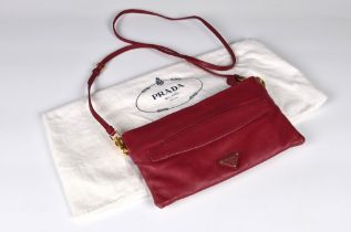 A two colour leather clutch bag by Prada ref. BT0680, 'nappa folders' leather in Ibisco and Anemo