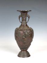 A Japanese patinated bronze vase Meiji period, decorated with pairs of birds on branches, the