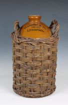 A large two gallon Standish & Co Limited Liverpool flagon in basket 17in. (43.2cm.) high. *