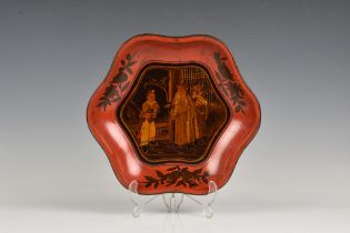 A Chinese lacquered wood hexagonal dish probably early 20th century, the central reserve painted