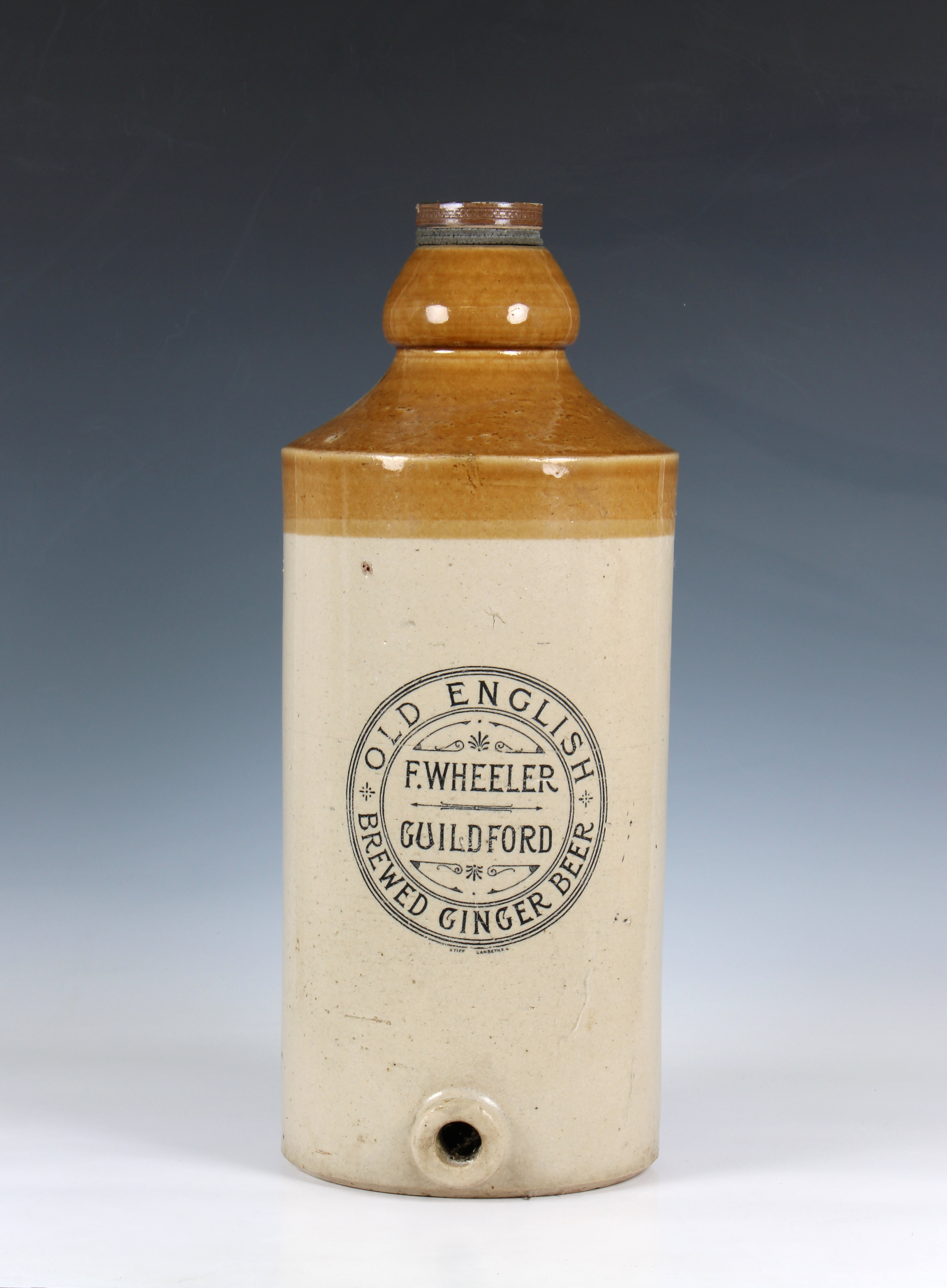 A large F Wheeler Guildford old English brewed ginger beer stoneware dispenser screw top, no tap,