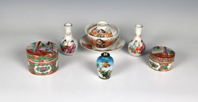 A small collection of Oriental ware to include two famille rose cylindrical pots with covers, the