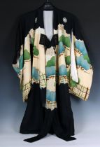 A Japanese silk Kimono black silk with multi-coloured embroidered landscape to the front and a