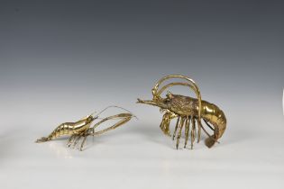 A polished bronze crayfish 11in. (28cm.) long, 8in. (20.3cm.) high, together with a brass