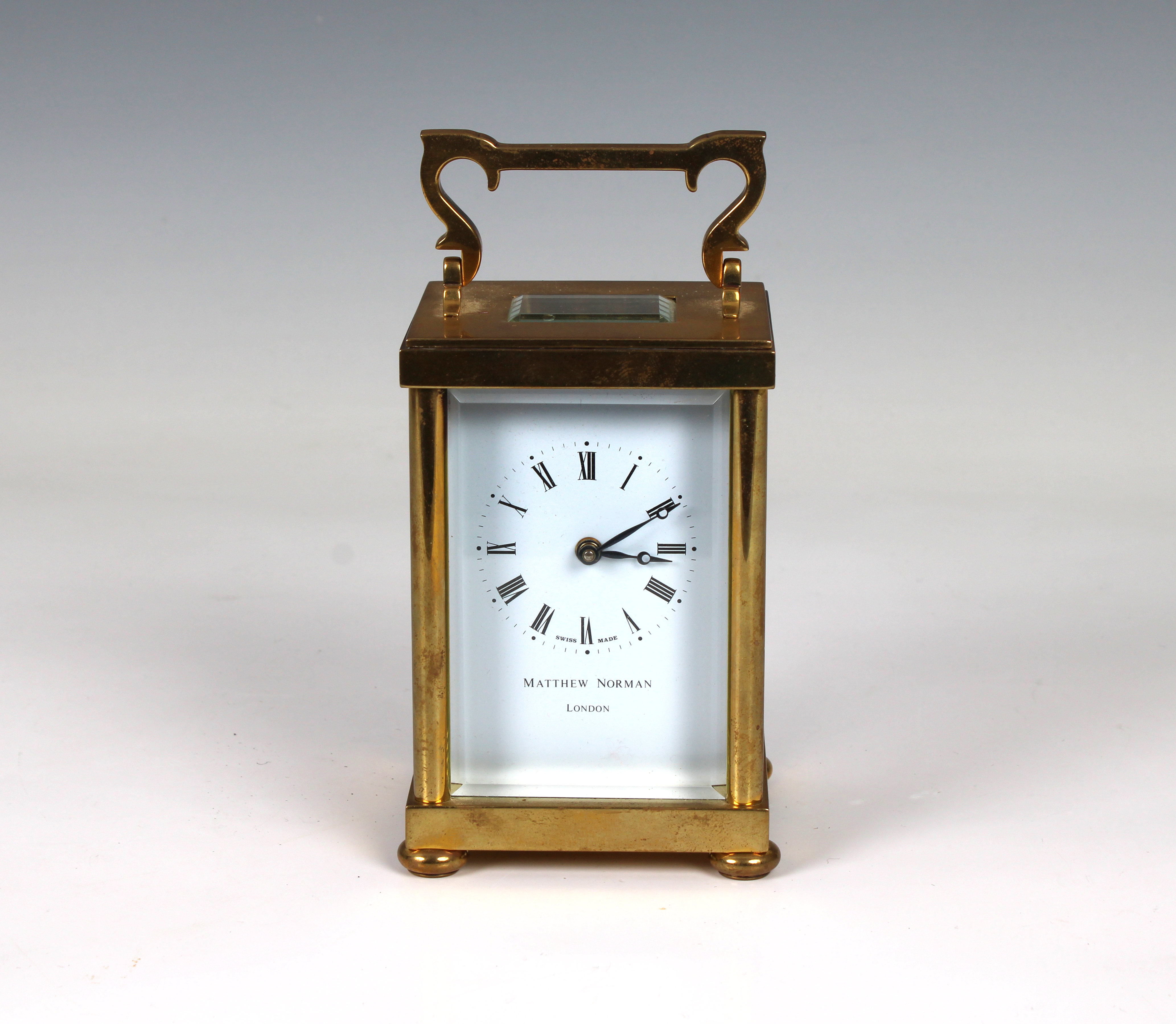 A Matthew Norman carriage clock 20th Century, with visible escapement, white dial with Roman