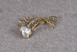 An 18ct two colour gold and baroque pearl fish brooch stamped with maker's mark and '750', the