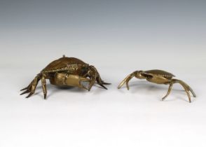 A novelty brass shop counter bell fashioned as a crab push button to shell, red glass eyes,