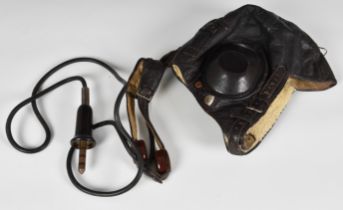 A WWII German Luftwaffe leather winter flying helmet (Fl Kopfhaube) complete with the original