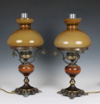 A pair of vintage Italian electric table lights in the style of antique oil lamps having pierced