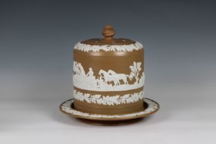 A late 19th century coffee coloured Jasperware cheese dome and stand probably Wedgwood, unmarked,