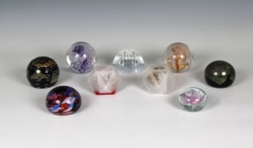 A collection of seven Guernsey and Sark glass paperweights varying sizes, to include two gold /