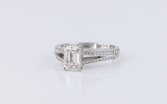 A platinum and diamond ring the principal approx. 1.23ct emerald cut diamond with accompanying GIA