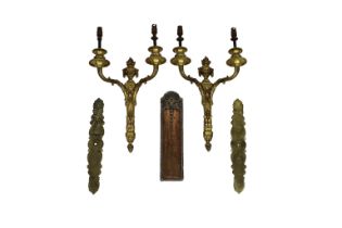 A pair of Louis XVI style twin light gilt metal wall appliques 20th century, with flaming torch