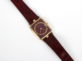 A Raymond Weil Geneve gold plated quartz watch with burgundy face Roman numerals, date, burgundy