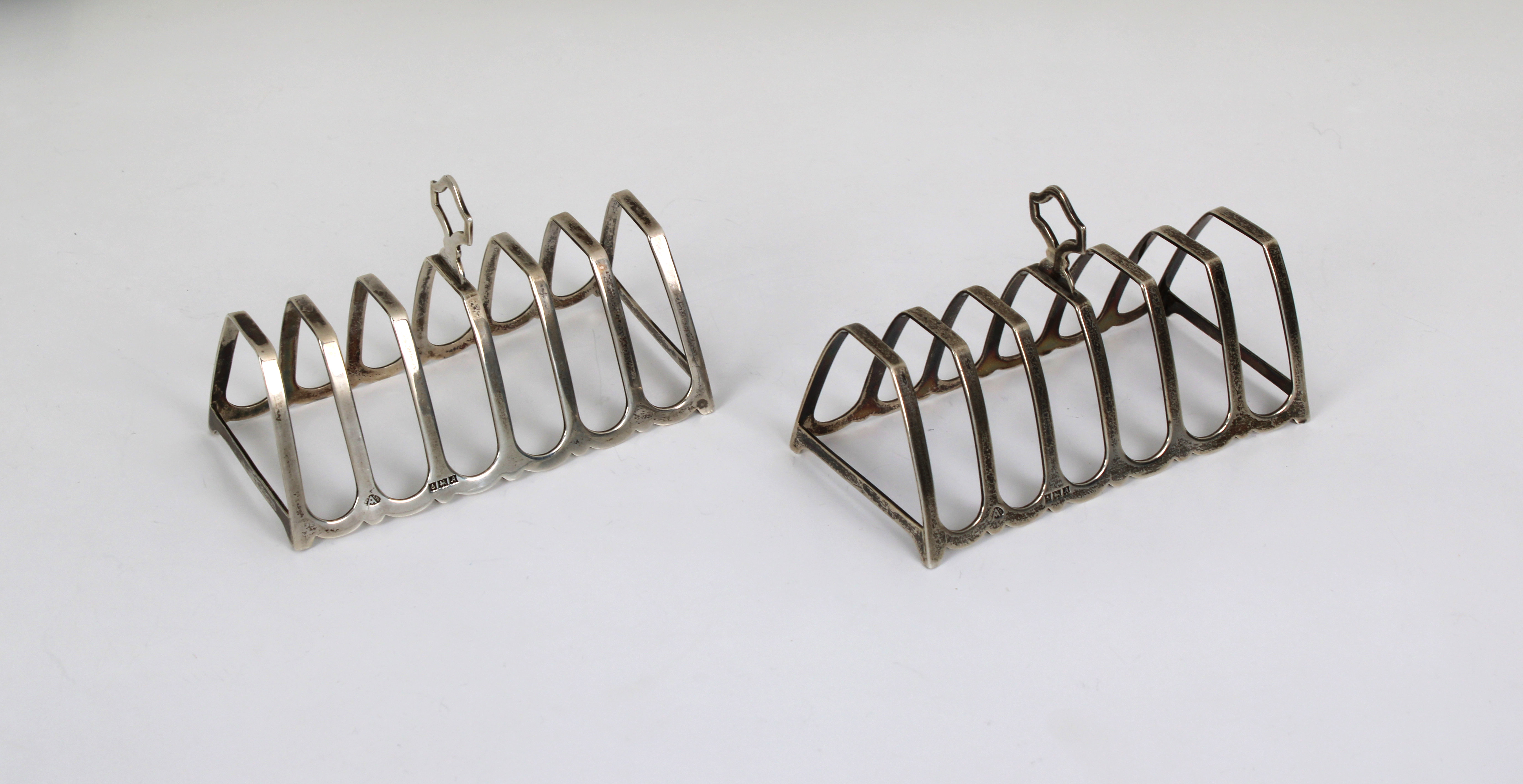 A pair of 20th century silver toast racks Adie Brothers Ltd, Birmingham, 1950, 4¼in. (10.8cm.) long,