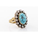 A turquoise and diamond ring