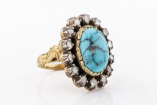 A turquoise and diamond ring