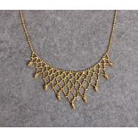 A petite 9ct gold necklace with lattice fringe