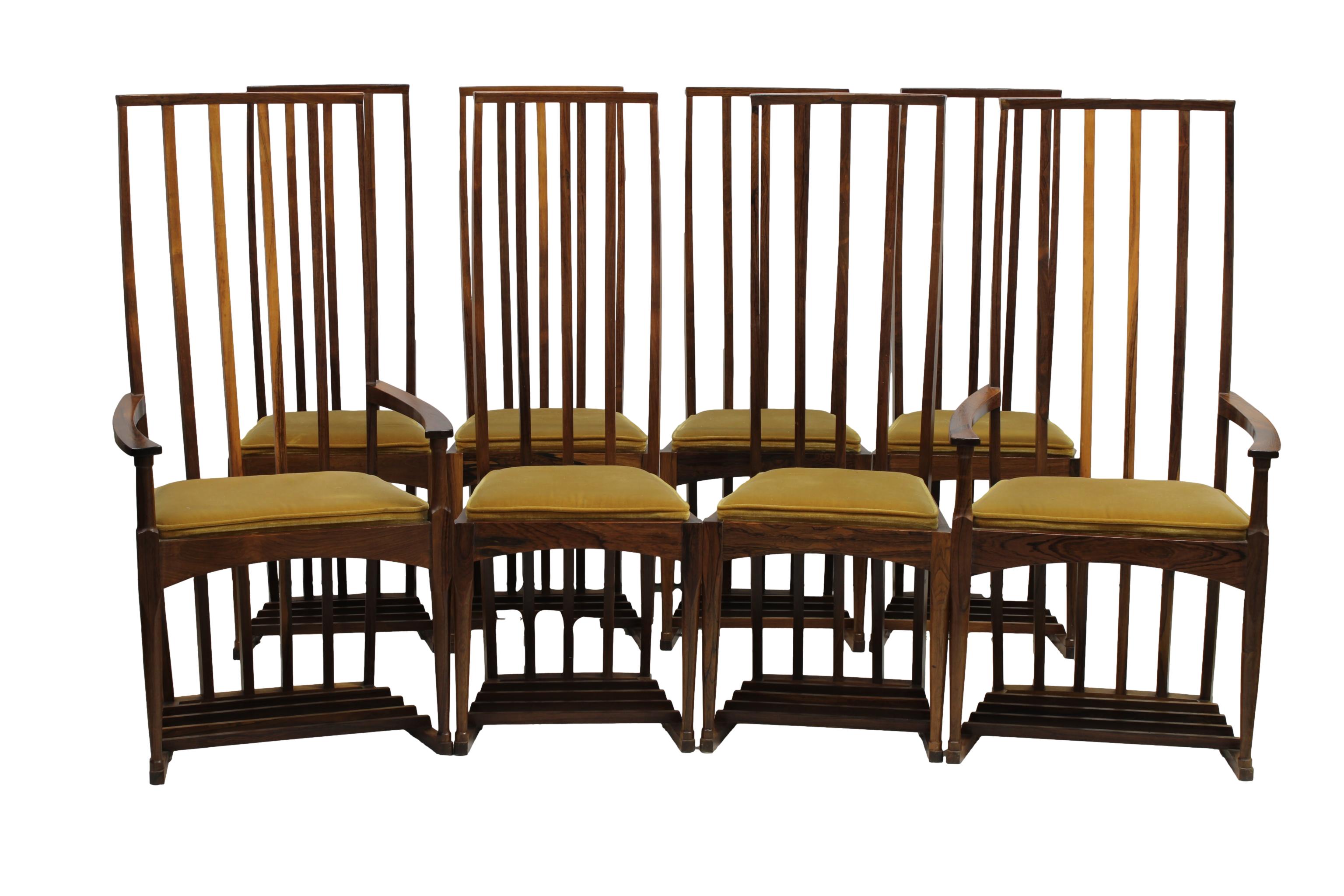 A set of eight high backed rosewood dinning chairs in the style of Charles Rennie Mackintosh