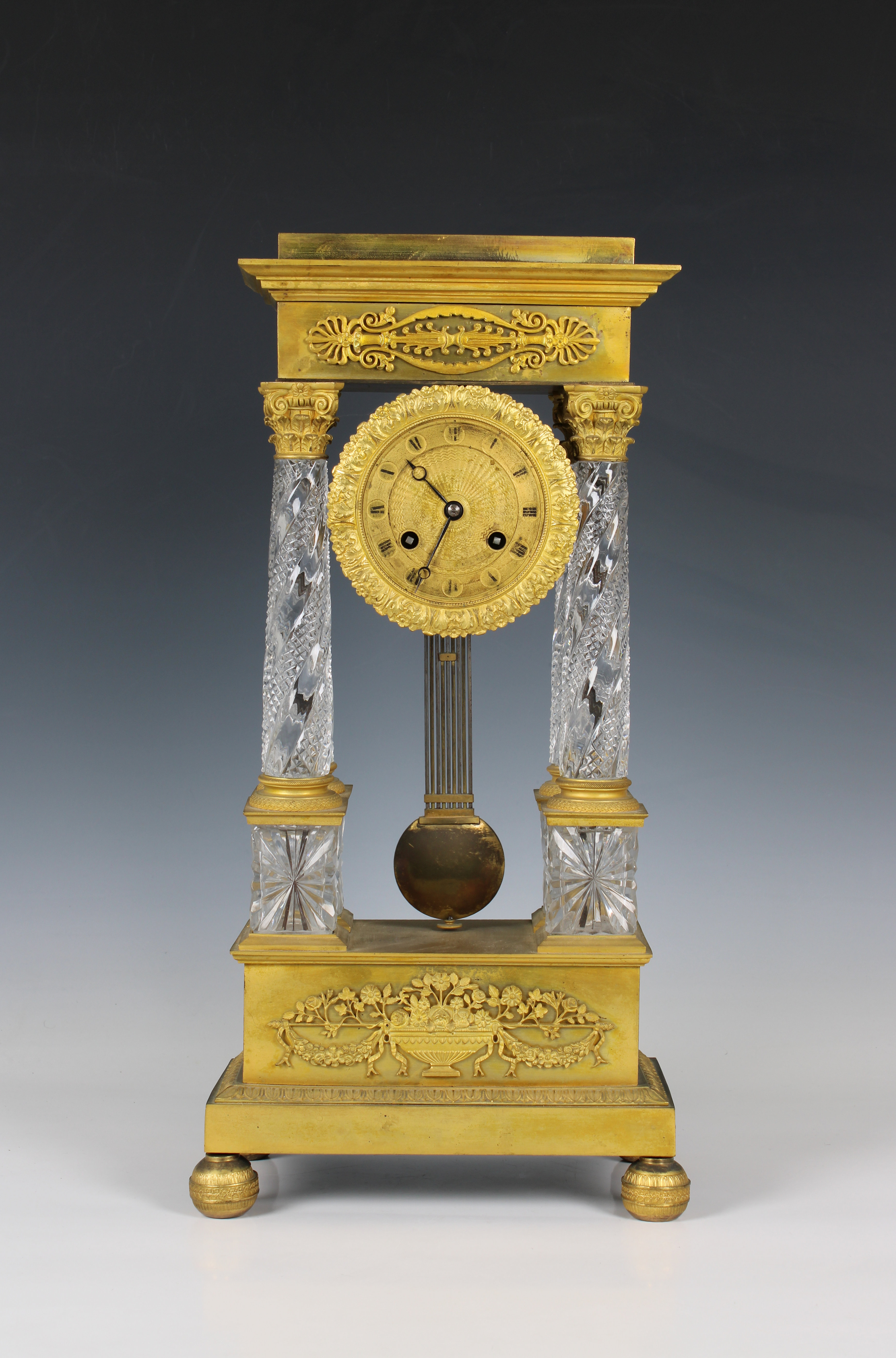 A French Charles X gilt bronze and cut crystal portico mantel clock