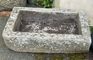 A rectangular granite trough