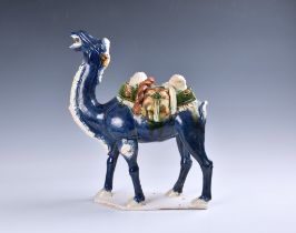 A Chinese sancai glazed, Tang Dynasty style figure of a caparisoned camel