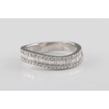 A diamond wavy half eternity ring