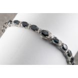 An 18ct white gold, sapphire and diamond bracelet