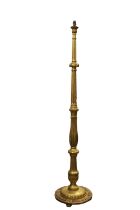 A carved gilt wood standard lamp