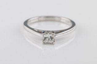 A diamond solitaire ring