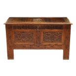 An early 20th century carved oak coffer