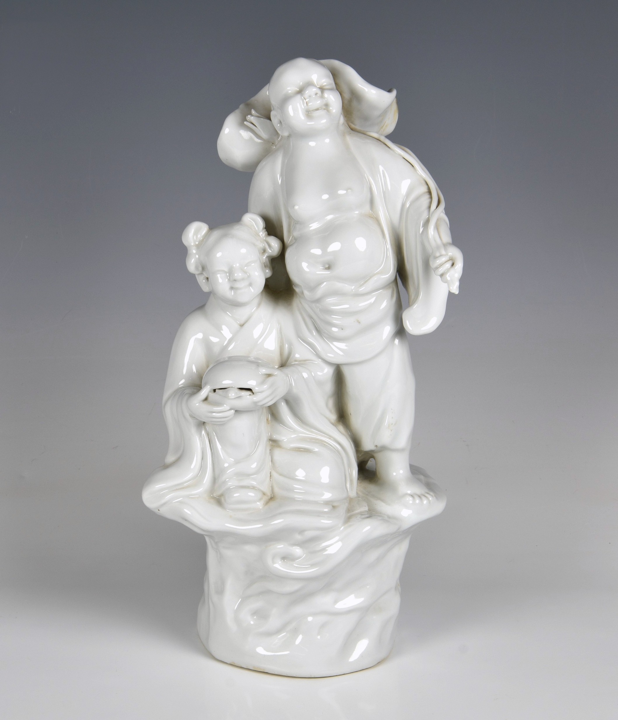 A Chinese porcelain blanc-de-chine figural group of Buddha and attendant