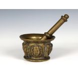 A 17th century figural brass apothecary pestle and mortar