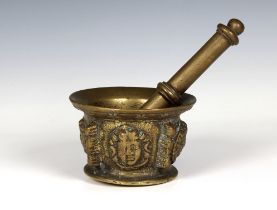 A 17th century figural brass apothecary pestle and mortar