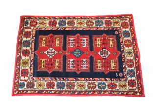 A Kazak triple medallion flat weave rug