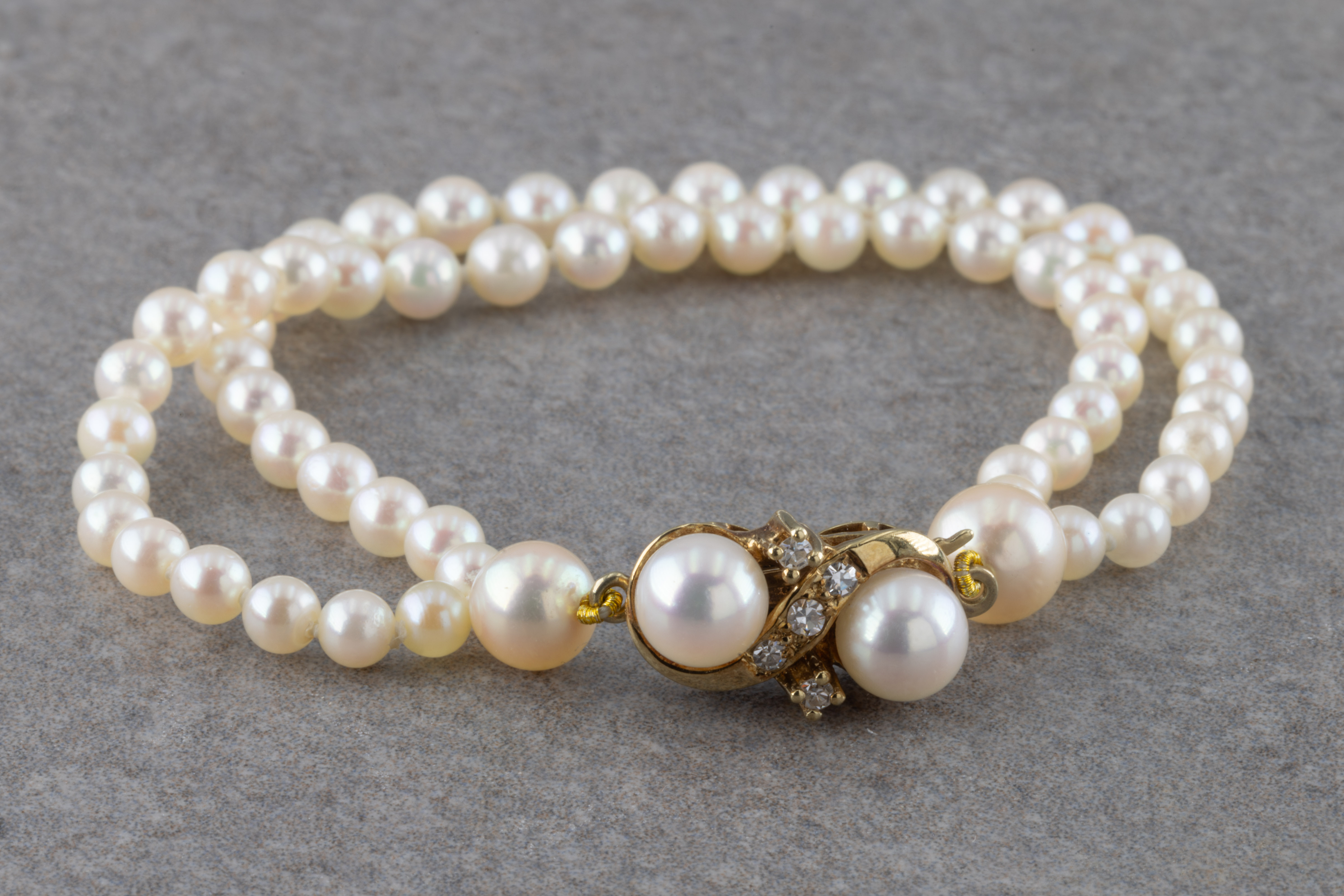 A pearl and diamond bracelet