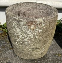 A granite cylindrical bird bath / planter or garden feature