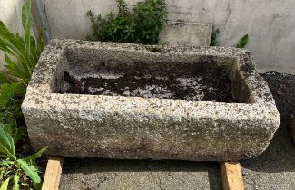A rectangular granite trough