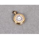 An Edwardian 14k gold-cased ladies fob watch with blue enamelled Roman numerals outer
