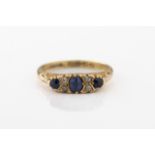 An 18ct yellow gold, sapphire and diamond ring