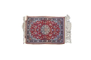 A signed silk fringe Isfahan rug
