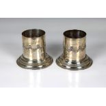 A pair of Edwardian silver bottle coasters