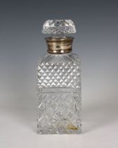 A silver mounted cut glass decanter