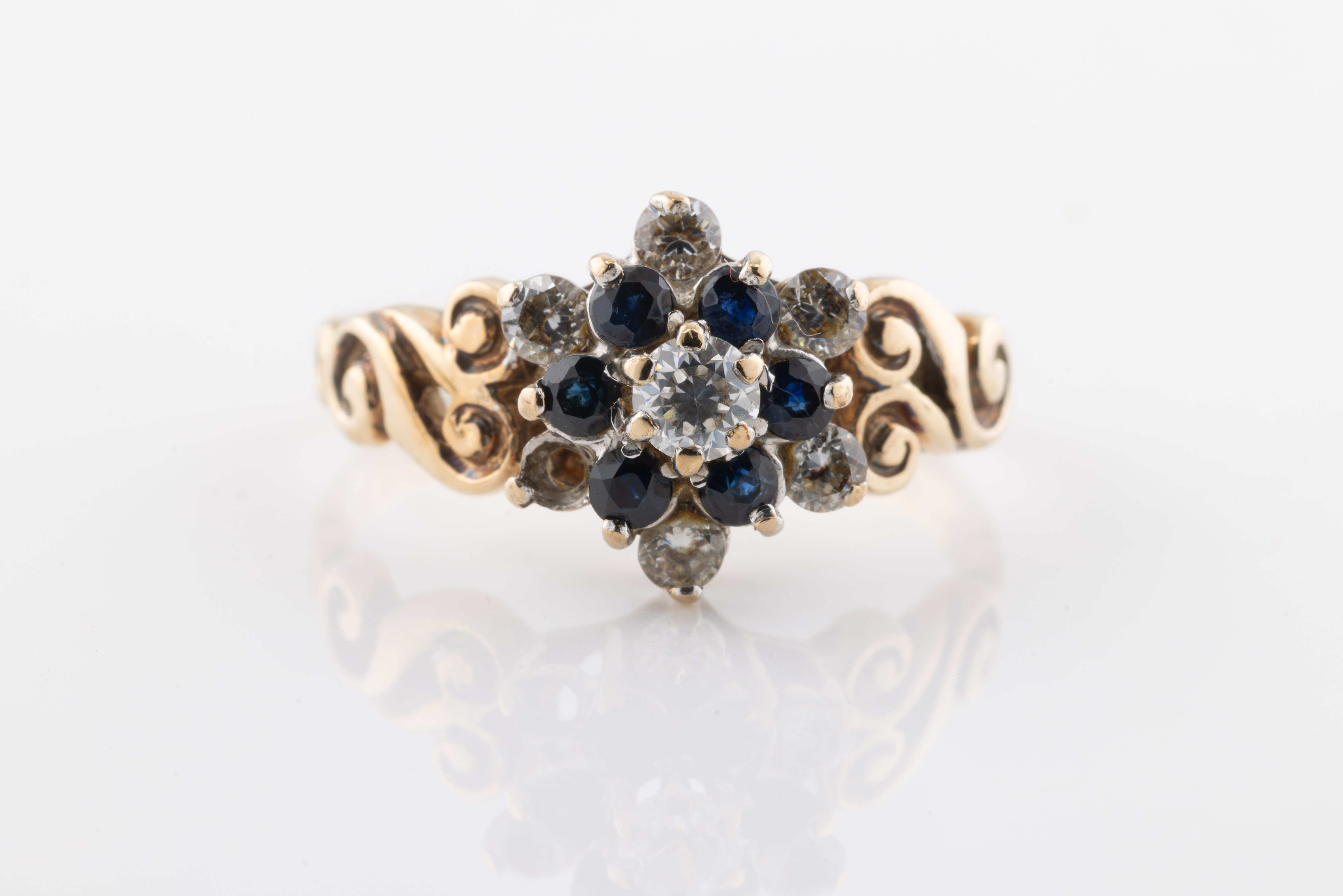 A 9ct yellow gold, diamond and sapphire ring